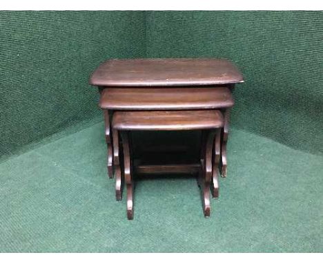 A nest of three Ercol tables