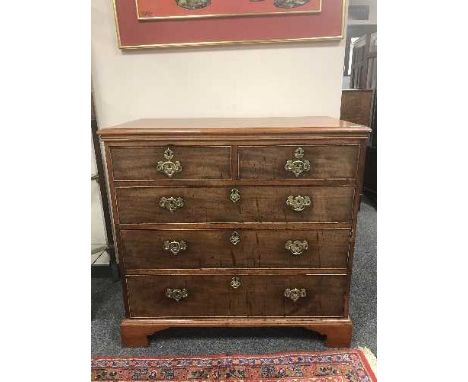 An antique mahogany chest of five drawers on bracket feet 