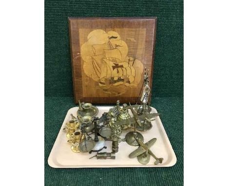 A collection of brass collectables inlcuding 1940's Brisol Baufort and Hawker Hurricane planes, ornate brass scales, miniatur