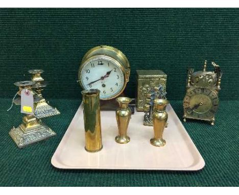 A circular brass Smiths clock, pair of candlesticks, tea caddy, carriage clock, shell casing etc 
