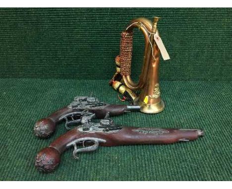 A brass and copper military bugle and two reproduction flint lock pistols 