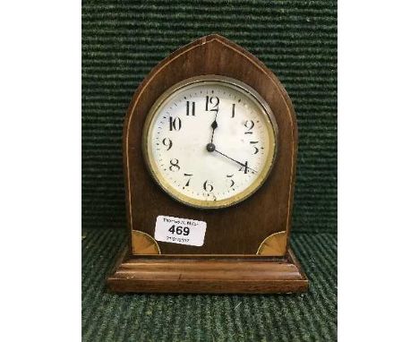 An inlaid mahogany arched topped mantel clock 