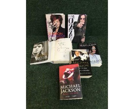 A collection of books relating to rock and pop including signed volumes by Ozzy Osbourne, an Elvis No. 1 hits, Michael Jackso