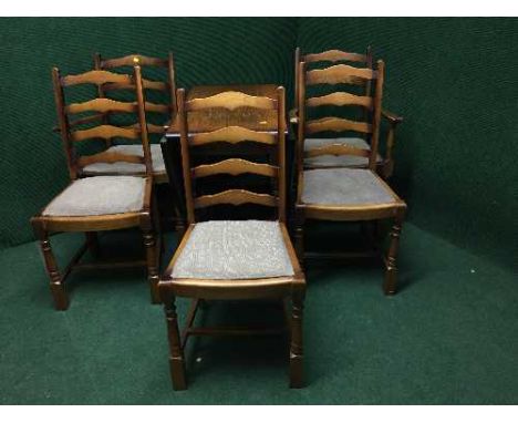 An oak gateleg table together with a set of four ladder backed chairs