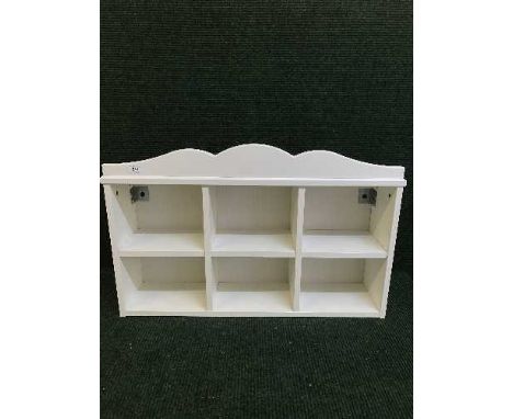 A white Ikea wall shelf 