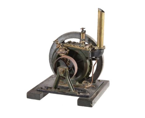 A rare Victorian rotary stationary engine, of unusual design. Spoked flywheel 28cm in diameter, vertical polished brass exhau