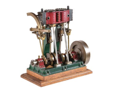 A well-engineered model of a twin simple vertical marine engine, model engineer built from castings with lever operated Steph