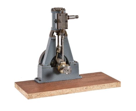 A vertical live steam stationary engine, with single cylinder approximately 2 inch bore x 1 ¼ inch stroke, lagged in blued st