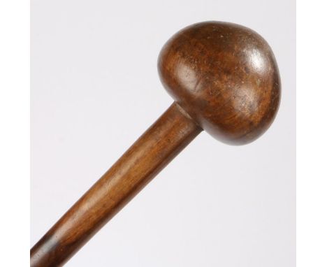 A Southern African knobkerrie, the domed head above a long shaft, 77cm long&nbsp;