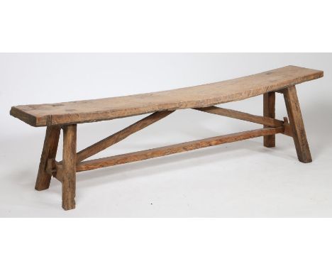 Rustic pine country bench, having a thick single plank seat raised on square legs united by stretchers, 190cm long, 31cm deep