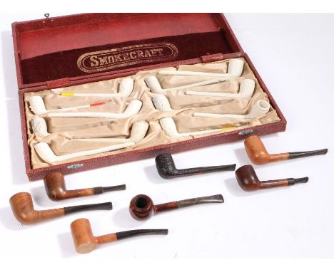 A collection of clay pipes, within the Smokecraft case, together with some wooden pipe, (qty)