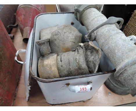 A selection of vintage brass water hose fitments and enamel bread bin