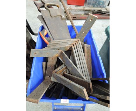 A selection of vintage tools and heavy duty cast wall brackets