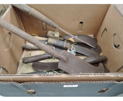 A selection of vintage hedge laying tools bill hooks and timber splitting knifes including Elwell