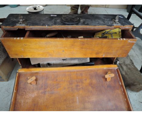 A selection of vintage woodworkers tools and carry tool chest