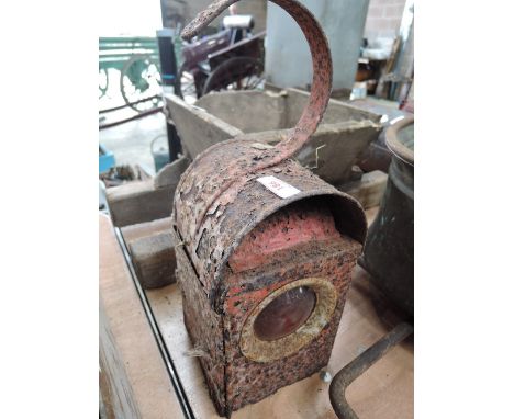 A vintage lamp with red glass