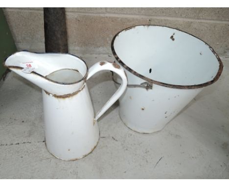 A vintage white enamel bucket and jug