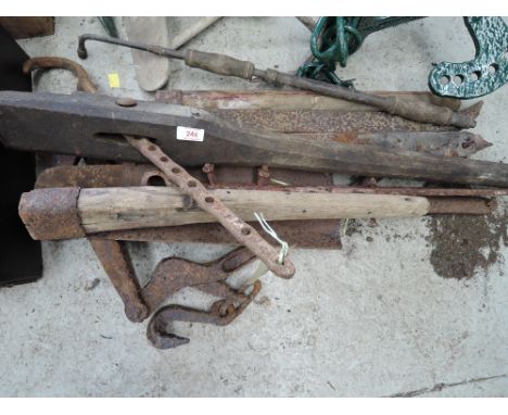 A selection of vintage farm implements and tools