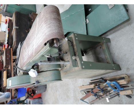 An electric Woodwise disc and belt sander on stand
