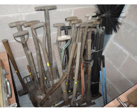 A selection of vintage garden and landscaping shovels forks and similar digging tools