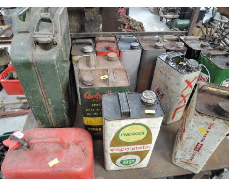 A selection of vintage oil fuel and petrol cans including Shell BP and EVCO