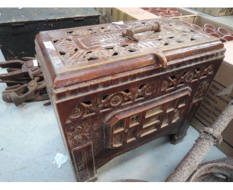 A vintage French cast and enamel log burning stove