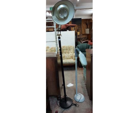 A Lloytron uplighter style floor lamp - sold with a modern floor standing heat lamp