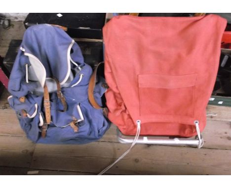 Two vintage canvas rucksacks with leather straps
