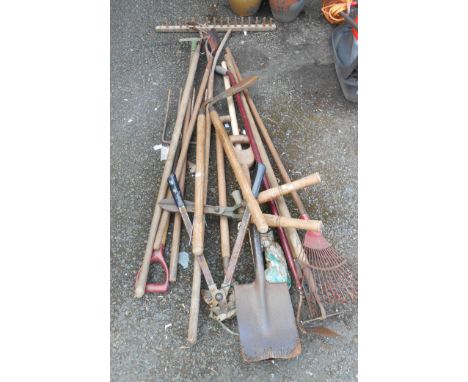 A quantity of garden tools including shears, rakes, etc.