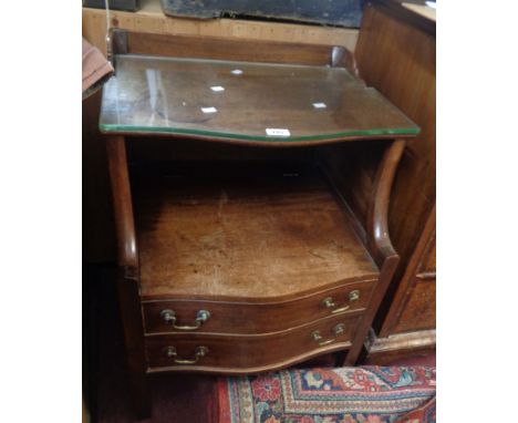 A 56cm 19th Century mahogany serpentine front commode with shaped glass top and two drawers under, set on square legs