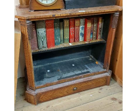 A 70cm old kingwood quarter veneered two shelf open bookcase with flanking fluted and canted corners, containing a selection 