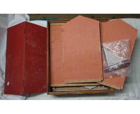 A vintage fold-away doll's house set in fitted wooden box