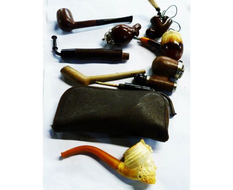 A bag containing a quantity of various pipes and pipe bowls including a Meerschaum example in small case, a Hardcastle's pipe