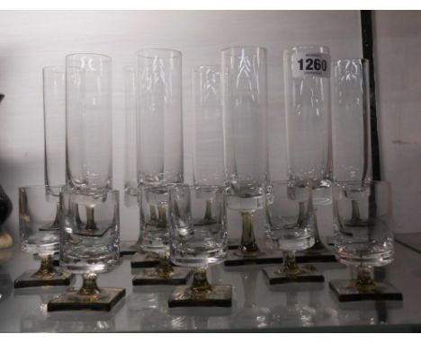 A set of eight vintage Rosenthal Studio Line Berlin pattern champagne flutes, with smoky brown foot and clear stem, designed 