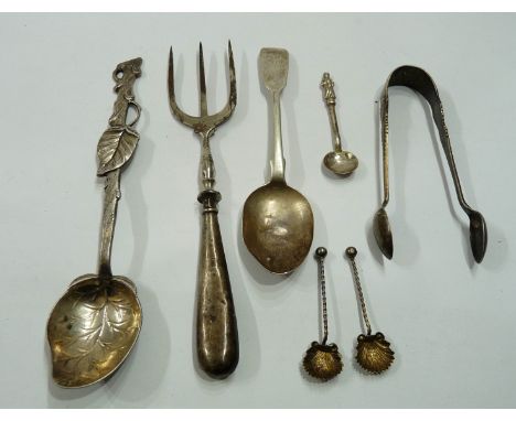 A bag containing an ornate 800 grade foliate pattern spoon, silver handled muffin fork, sugar tongs and small spoons