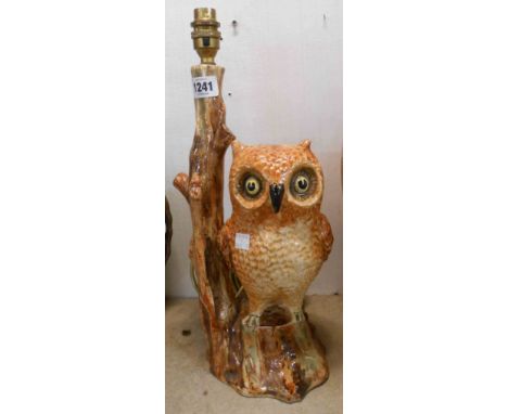 A large Torquay pottery table lamp, modelled as an owl seated on a tree beside a branch