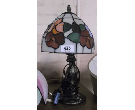 A small contemporary Tiffany style lamp with coloured glass shade