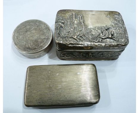 Three foreign white metal collectable boxes comprising a Dutch snuff box with ribbed decoration, a trinket box with embossed 