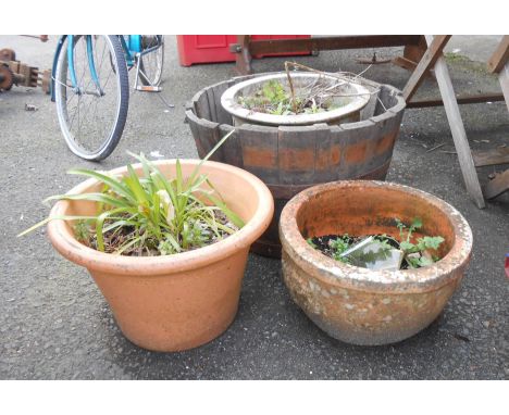 Three large garden plant pots - sold with a coopered half-barrel planter
