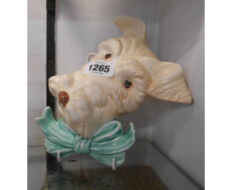 An Art Deco Beswick pottery wall mask in the form of a terrier wearing a bow tie - Model No. 301