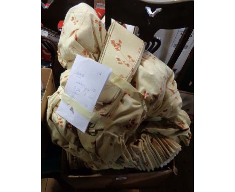 A box containing three sets of yellow patterned curtains with floral, red and brown designs by Montgomery