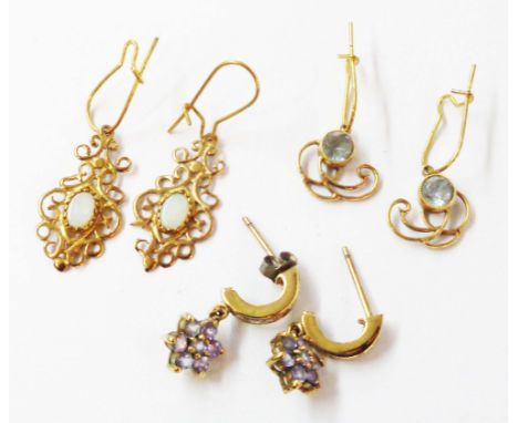 Three pairs of yellow metal earrings comprising aquamarine, opal and blue paste