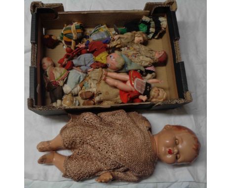 A box containing a quantity of assorted dolls and a Pelham puppet (no strings)