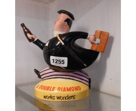 A vintage Beswick pottery 'Double Diamond' advertising pub water jug, depicting a stylised gentleman with beer bottle and bri