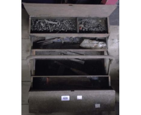 An old rusty toolbox containing a quantity of nuts, bolts, tools, etc.