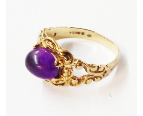 A 375 (9ct.) gold ornate antique style ring, set with amethyst cabochon - size K 1/2