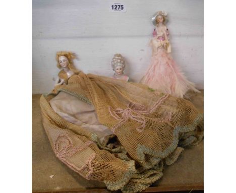 A large Edwardian pin cushion doll, with applied hair and original long dress - sold with a similar feather brush example and