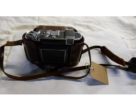 A vintage Zeiss Ikon camera in original marked leather case