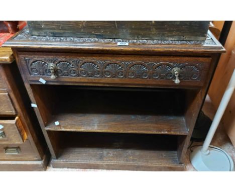 A 78cm 20th Century carved oak two shelf open bookcase with drawer to top, set on plinth base