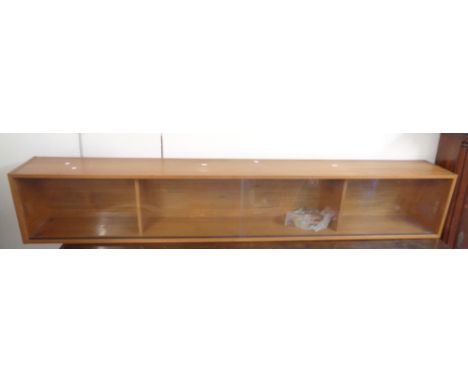 A 1.98m retro teak effect shelf unit enclosed by a pair of glass sliding doors